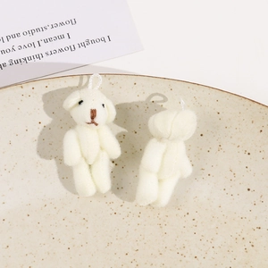 Detailed close-up of two white plush mini bears with soft texture for DIY keychains