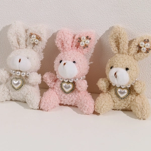 Cute plush bunnies with pearl necklaces and heart charms in white, pink, and khaki colors