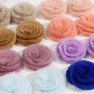 Close-up of 4cm fluffy faux fur flower accessories in various pastel colors for DIY crafts