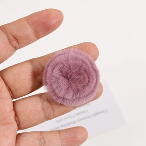 Detailed macro view of 4cm purple faux rabbit fur pom pom flower for DIY hair accessories