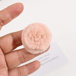 Close-up of a soft 4cm pink rabbit fur floral ball for DIY hair accessories and decorations