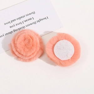 Detailed view of pink faux rabbit fur flower charms with white felt base for DIY