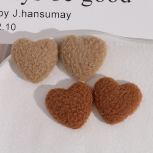 Plush lamb wool heart-shaped patches in brown and tan for DIY winter accessories
