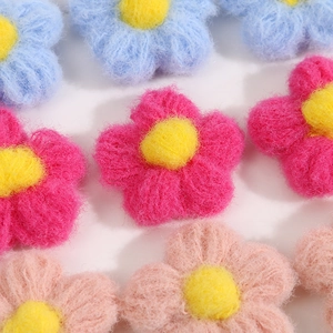 Handmade knitted colorful puff flowers for DIY accessories in pink, blue and rose red