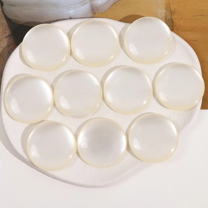 Macro shot of 10-piece 34mm round opal resin flatback cabochons for DIY crafts