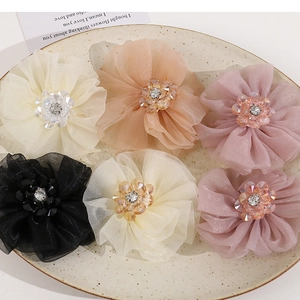 Set of mesh flower hair accessories with crystal centers in cream and pink tones