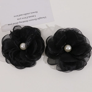 Set of two black mesh flower hair clips with pearl centers for elegant hair styling