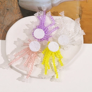 Handmade beaded lily of the valley tassel charms in purple, pink, yellow and white colors