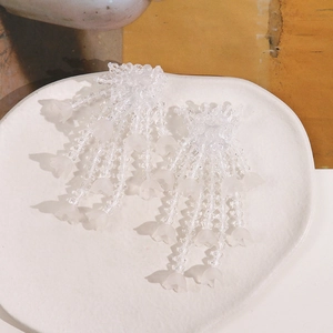 Handmade Lily of the Valley earrings with frosted petals and beaded tassels for women