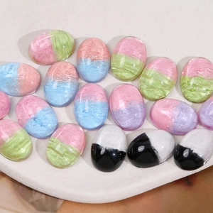 Colorful gradient oval resin patches in a heart tray for DIY jewelry making and phone cases