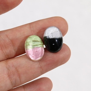 Detail view of oval resin patches with two-tone color layers for DIY phone cases