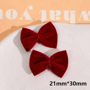 Detail view of 21x30mm burgundy velvet bowknot charms for DIY hair accessories