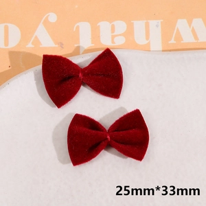 Detailed macro view of 25mm velvet red handmade bow accessories for DIY hairpins and jewelry