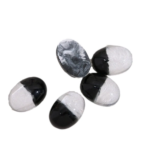 Five oval resin patches with creative black and white marble patterns for DIY crafts