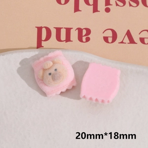 Detail of pink flocked bear charm and flat back base for DIY craft size 20mm by 18mm