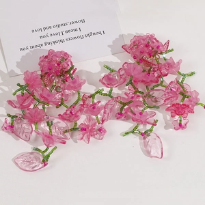 Handmade beaded pink flower cluster with green leaves for DIY hair accessories and jewelry