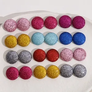 Detail shot of multi-colored round glitter stud earrings in a professional 12-pair set