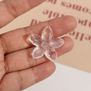 Detail view of transparent faceted acrylic flower beads for DIY jewelry making