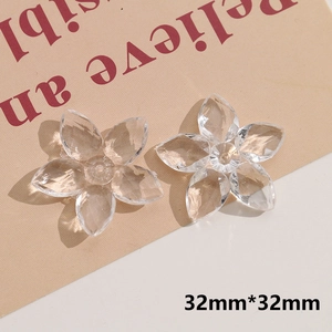 Macro detail of 32mm transparent acrylic five-petal flower charms for DIY jewelry making