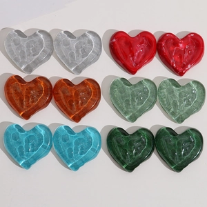 Detailed grid of colorful heart-shaped resin charms with rippled water texture