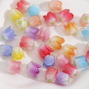 Macro shot of colorful resin tulip beads with glitter for DIY jewelry making