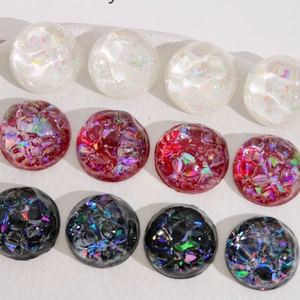 Detailed view of 20mm gradient AB resin half-bead charms with holographic foil inlays