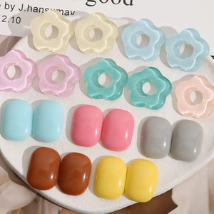 Close-up of colorful resin candy color floral and geometric DIY jewelry craft accessories