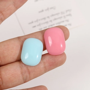 Oval resin charms in pastel blue and pink for DIY jewelry and phone case making