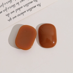Flat oval resin accessories in caramel amber finish for DIY jewelry and hair clips