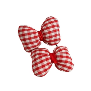 Pair of red and white gingham checkered fabric bow hair clips for vintage hair styling