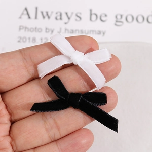 Set of two handmade velvet ribbon bow earrings in black and white colors for women