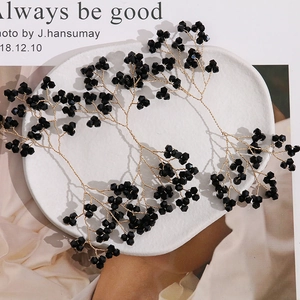 Handmade black crystal floral branches with gold wire for elegant hair styling
