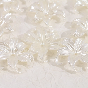 Close-up of pearl white irregular flower beads with center holes for DIY jewelry making