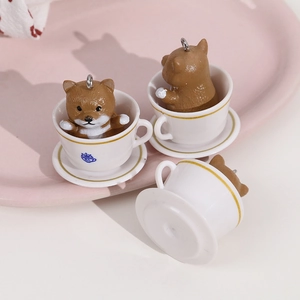 Detailed view of three mini resin shiba inu dog charms in white coffee cups figurines