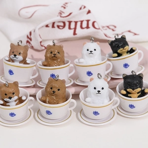 Miniature resin puppy figurines in white coffee cups with gold trim for DIY decor