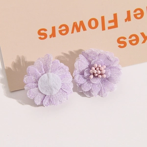 Close-up of handmade purple layered mesh flowers with pollen detail for DIY accessories