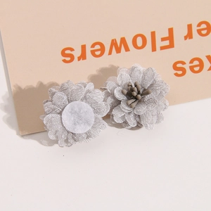Macro detail of 3D grey mesh fabric flower accessories for DIY jewelry with stamen
