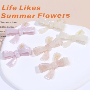 Chic acetate bow hair clips in cream pastel colors with France Handmade gold lettering