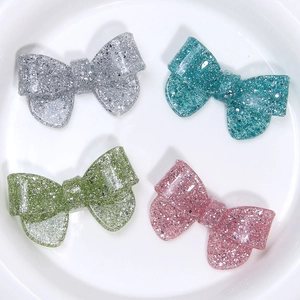 Sparkly glitter resin bow accessories in four colors for DIY hair clips and phone cases