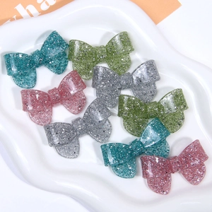 Set of 8 glitter resin bow hair clip accessories in four pastel colors for DIY jewelry