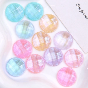Glittery faceted round resin cabochons in macaron colors for DIY craft decoration