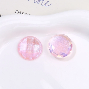 Macro shot of iridescent pink glitter cabochon with geometric facets for DIY crafts