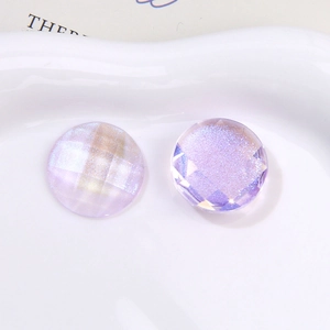 Macro detail of aurora purple faceted round glitter resin cabochons for DIY accessories