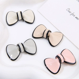 Detailed view of Morandi-toned 3D bow ornaments for DIY jewelry and phone accessories