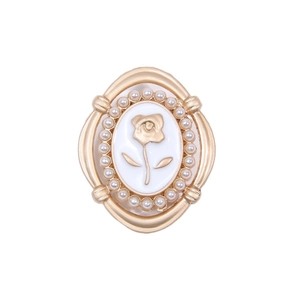 Vintage gold alloy oval brooch with pearl borders and embossed rose flower details
