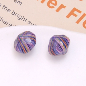 Macro detail of retro oil painting style striped resin beads for DIY jewelry making