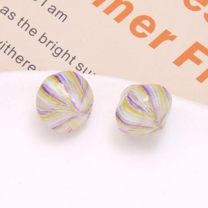 Detailed view of colorful striped resin earrings on a white plate with prop card
