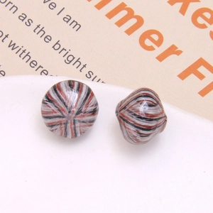 Macro detail of vintage oil painting style striped resin beads for DIY jewelry making