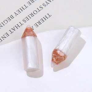 Pearlescent white resin pencil charms with metallic rose gold accents for DIY crafts