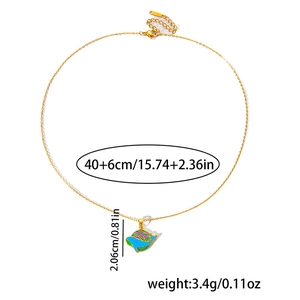 Detail view of gold dolphin pendant with colorful enamel stripes and 40+6cm chain size